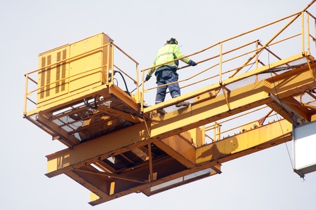 Setting up a tower crane in the construction siteの写真素材