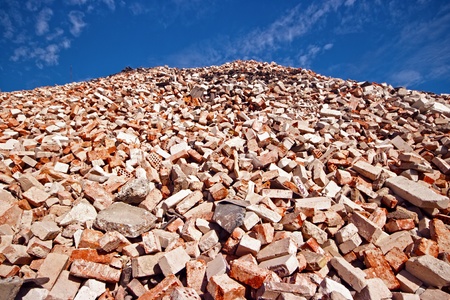 Pile of bricks in demolition waste recycling site の写真素材