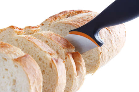 Sliced bread with knife, isolated on white