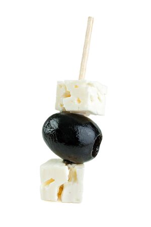 Olive and feta cheese in cocktail stick , isolatedの写真素材