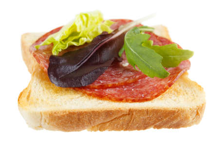 Toast with mettwurst cold cuts and lettuce leaves , isolated on whiteの写真素材