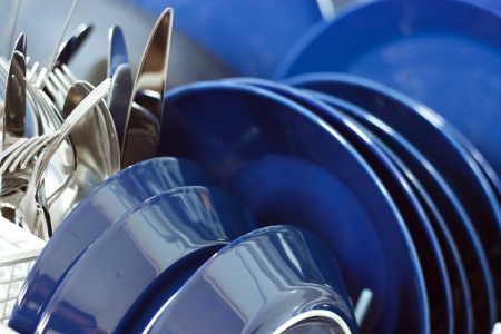 Dishwasher closeup with clean utensils