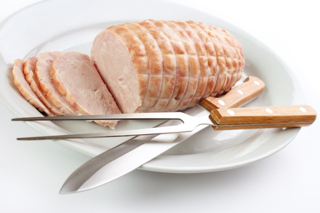 Oven roasted turkey roll and meat serving toolsの写真素材
