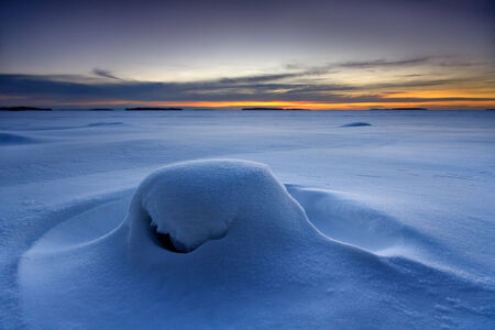 Snowy beach in winter morning in Finland