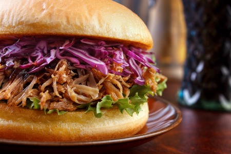 Pulled pork burger with red cabbage salad closeup