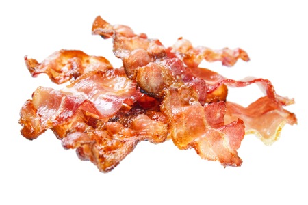 Fried bacon rashers , isolated on whiteの写真素材