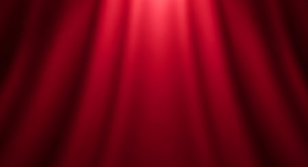 A rich, deep red stage curtain is dramatically lit from above by soft, diffused spotlight rays. The fabric drapes elegantly, creating a luxurious and inviting atmosphere perfect for any grand occasion.の素材