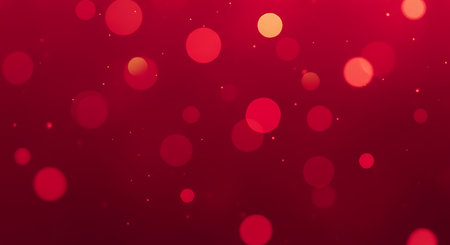 A deep red background with soft, out-of-focus circular bokeh lights in varying shades of red and orange. Subtle shimmering particles add a touch of magic to this abstract, elegant backdrop.の素材