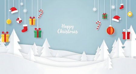 A charming, layered paper cut illustration depicts a serene winter landscape with snow-covered hills and stylized white trees. Festive Christmas ornaments dangle from above, adding a touch of holiday cheer.の素材