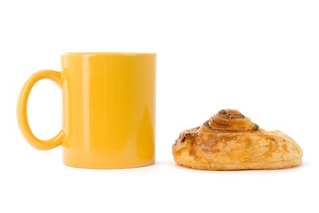 Yellow coffee cup with cookieの写真素材