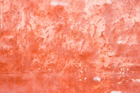 A rough red stucco textureの写真素材