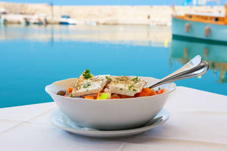 Greek salad with feta cheese on table  Rethymno, Crete, Greeceの写真素材