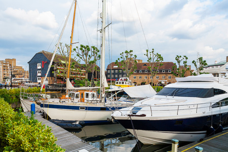 Yachts moored in St Katharine's Dock. London, England, UKの写真素材
