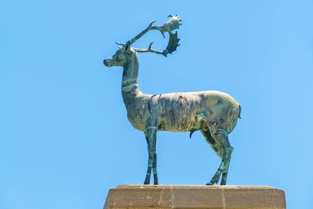 Bronze deer statue at the entrance to Mandraki harbour. Rhodes, Greeceの写真素材