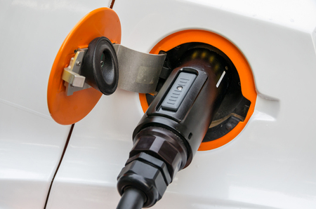 Charging cable with a plug in socket of a electric car
の写真素材