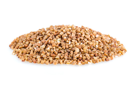Heap of buckwheat grain on a white backgroundの写真素材