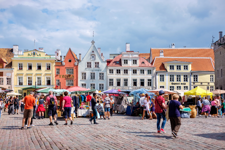 TALLINN, ESTONIA - JULY 21, 2018: Tourists visiting and shopping at Town Hall Square (Raekoja Plats) in old townのeditorial素材