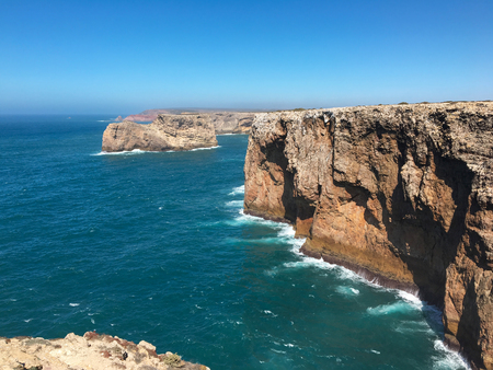 Rocky atlantic coastline at the south west point of mainland Europe. Cape Sao Vicente, Sagres, Algarve, Portugalの写真素材