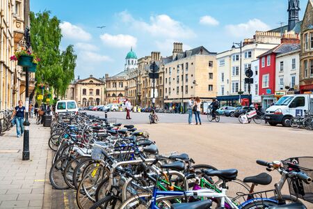 OXFORD, ENGLAND - JUNE 19, 2013: Walking people and parked bicycles on Broad Streetのeditorial素材