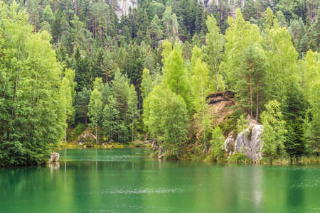 Green lake in the rock town in the Czech republic. Forest and lake in the rocky town in Bohemia.の写真素材