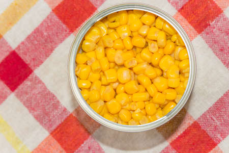 Cans of canned corn. Canned vegetables. Can of food