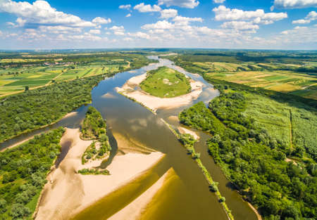 Island on the river. Vistula river and cow island seen from the air.