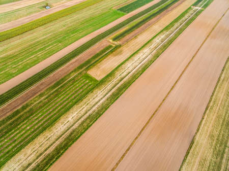 Rural landscape - farmland seen from the bird's eye view. Colorful stripes and lines.の写真素材