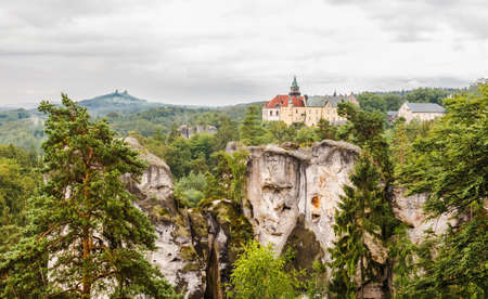 Czech Republic - Hruboskalsko Landscape Park. Landscape with rocks, a forest and a castle on the horizon.のeditorial素材