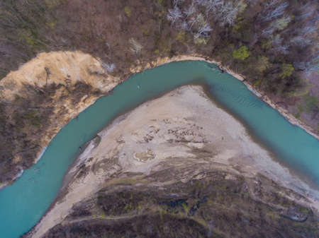 Top view on the bend of the river Pshekha. Landscape of rivers, forests, beach and clay hill.