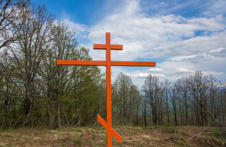 Iron memorial on the hill in the woods. Cross in memory of the victims of the second world war.の写真素材