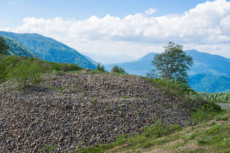 Pile of gravel under the open sky in the mountains.