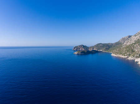 The rocky coast of Turkey and the Mediterranean sea.の写真素材