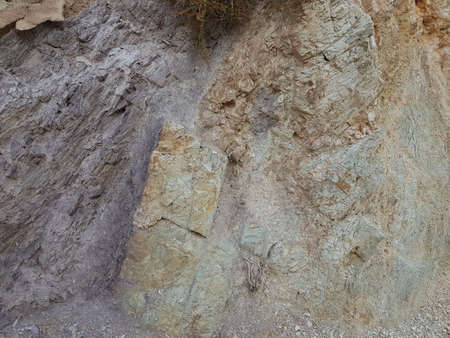 The texture of the gray stone of different structures. Photo surface of the rock.