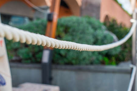 The fence of the white ropes. Selective focus.の写真素材