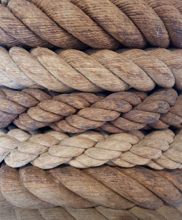 Natural old marine ropes. Closeup, selective focus.