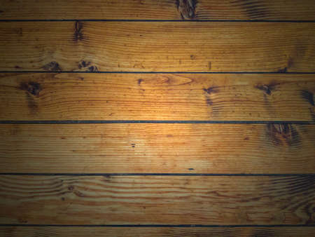 Background of pine horizontal boards highlighted in the center.の写真素材