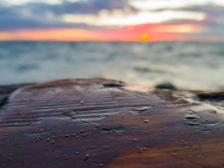 Water droplets on a wooden gunwale old sailing ship. Selective focus.の写真素材