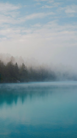 Beautiful landscape of turquoise lake in the morning mist.の素材