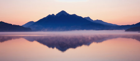 Panoramic view of a mountain lake at sunrise in Bavaria, Germanyの素材