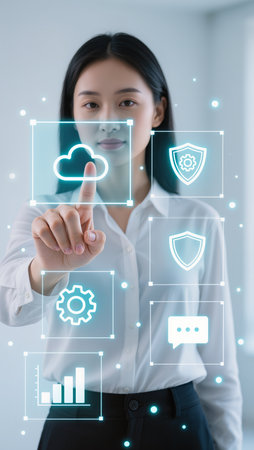 Businesswoman pointing at cloud computing icons on virtual screen. Business conceptの素材