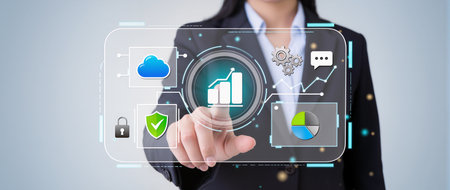 Businesswoman on blurred background using digital interface with icons 3D renderingの素材