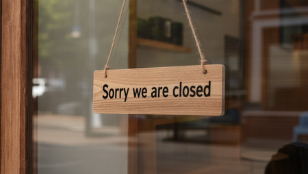 Wooden sign hanging on the door of a shop or restaurant with text: Stay at homeの素材