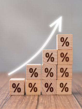 Wooden cubes with percentage symbol on wooden table. Business growth conceptの素材