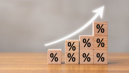 Wooden blocks with percent symbol on wood table. Business and finance concept.の素材