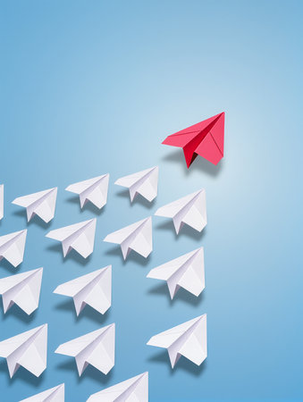 Leadership concept with paper plane leading among white paper planes on blue backgroundの素材