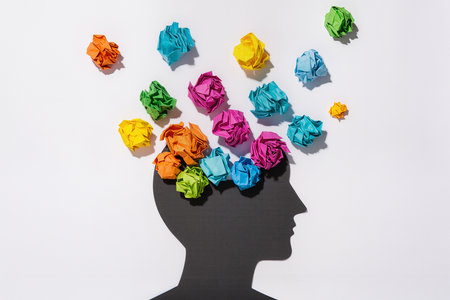 Human head with crumpled paper as a symbol of creativity and brainstormingの素材