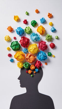 Silhouette of a man surrounded by colored crumpled paper ballsの素材