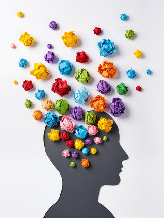 Silhouette of a human head with crumpled paper balls as a symbol of creativityの素材