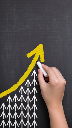 Hand drawing business graph on blackboard, business success and growth conceptの素材
