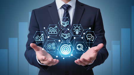 Businessman holding digital business interface with icons and symbols over his handsの素材